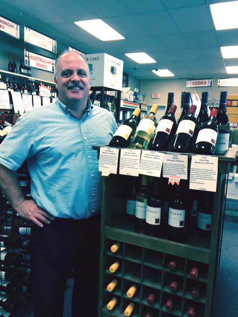 Anthony Di Monda, of Tri- Vin Imports Inc proudly stands by Esser display at Parkway Liquors, Rochester, NY!